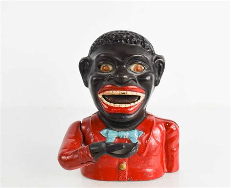 Vintage 'Greedy Boy' and similar cast money box / money safe